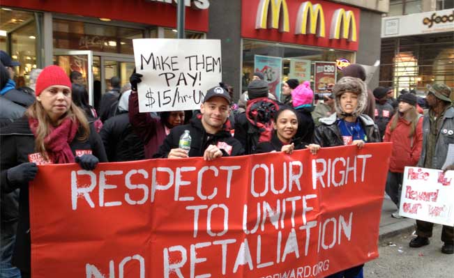 Workers from fast food and retail chains along State Street walk off their jobs in a protest for higher wages. Photo: John H. White - Sun-Times