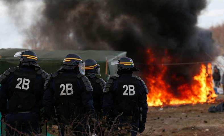 Twelve huts were set on fire during evictions from a camp in Calais. Photo: Wikipedia