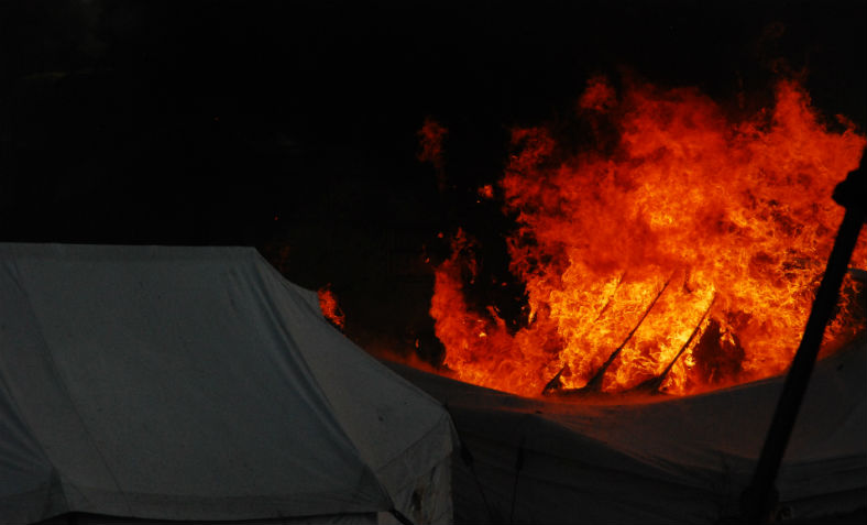 The Calais refugee camp on fire. Photo: Flickr/Michel Spekkers