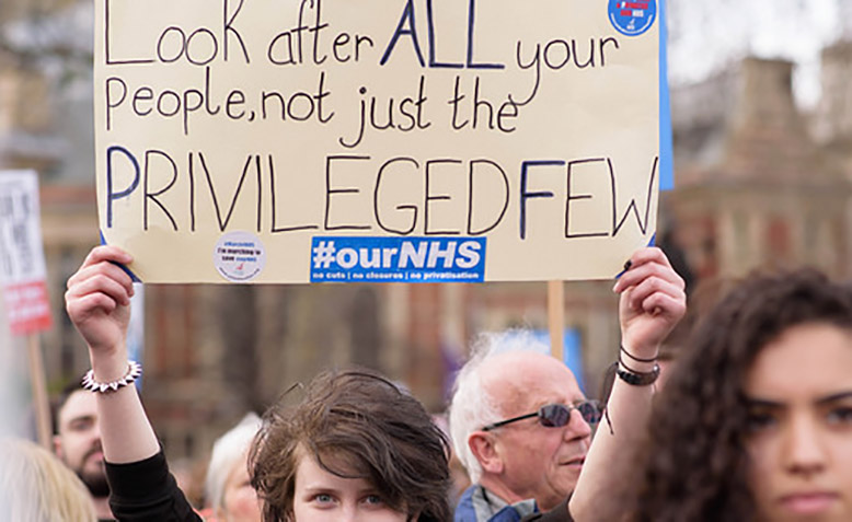 Protestor at 'It's Our NHS' demonstration, 4 March. Photo: Flickr / Counterfire / Jim Aindow