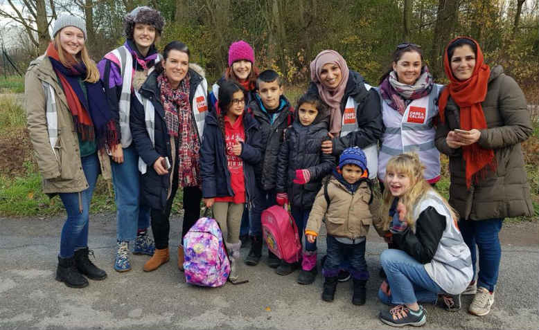 Care4Calais volunteers from Oxfordshire Refugee Solidarity with refugee families in Calais. Photo: David Bailey