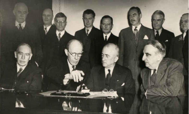 Keynes, bottom left, at the signing of the Anglo-American loan agreement in 1945. Photo: wikimedia commons