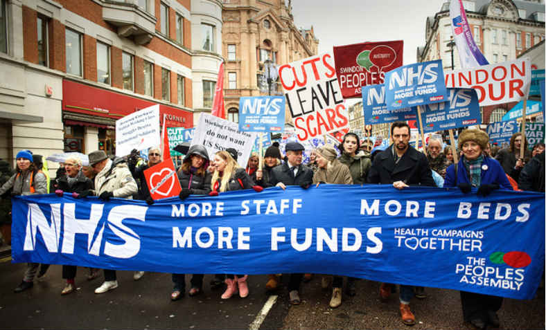 NHS demonstrators holding banner