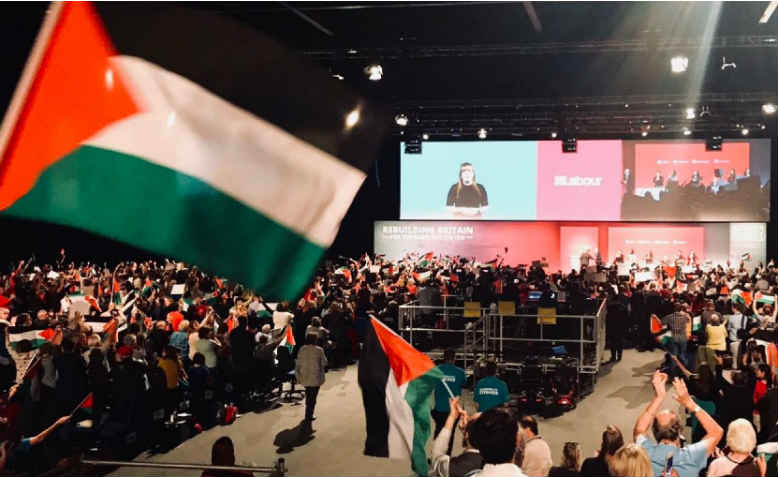 Labour Conference, delegates wave Palestinian flags. Photo: Palestine Solidarity Campaign