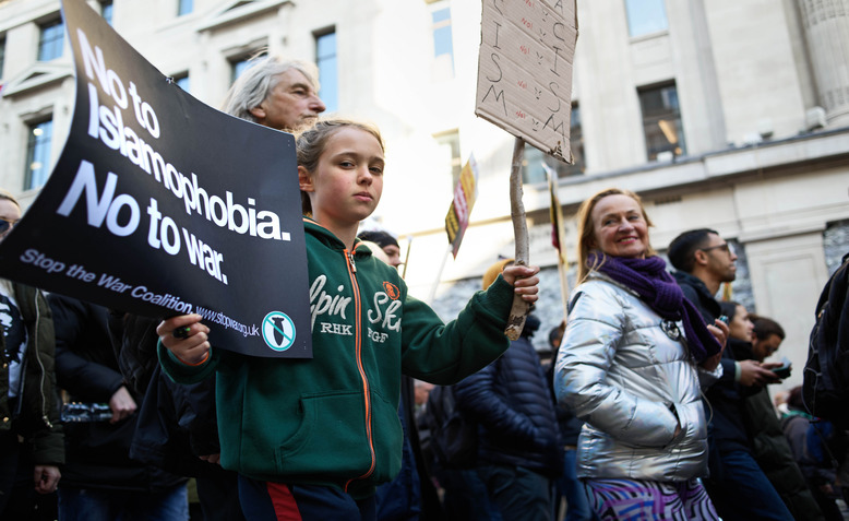 girl with anti-racist placard