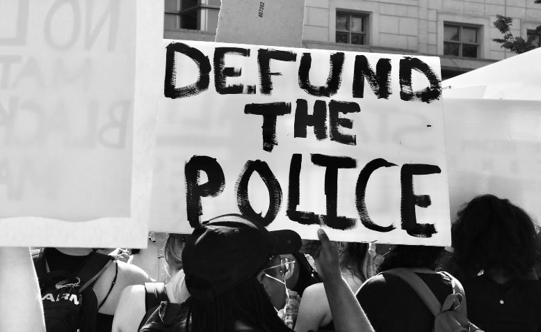 Defund the police. Photo: Taymaz Valley / Flickr / cropped from original / CC BY 2.0, licence and original photo linked at bottom of article