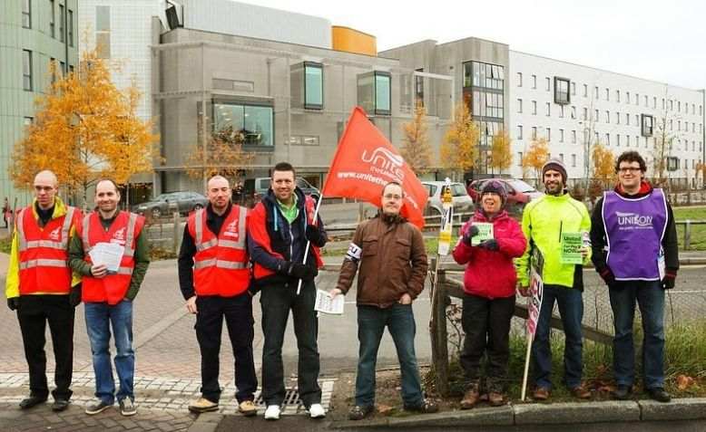 Pickets at the rear entrance to the University of East Anglia, December 2013. Photo: Roger Blackwell / Account: rogerblackwell /Flickr /cropped from original / licensed under CC 2.0, linked at the bottom of article