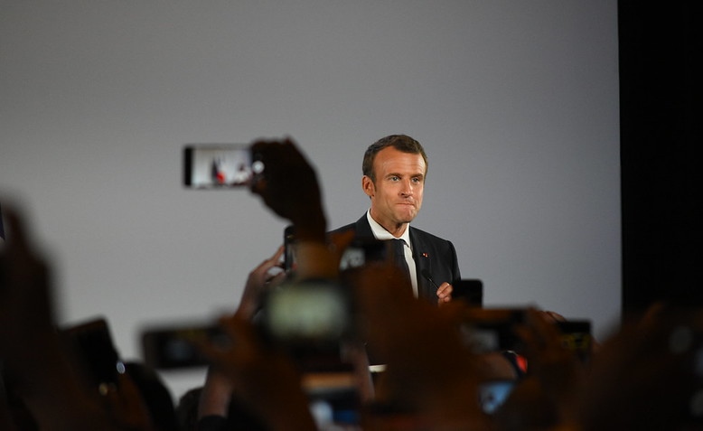 Emmanuel Macron making a speech. Photo: Amaury Laporte / Flickr / cropped from original / licensed under CC 2.0, links at the bottom of article