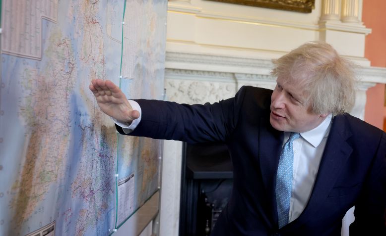 Boris Johnson in front of a map