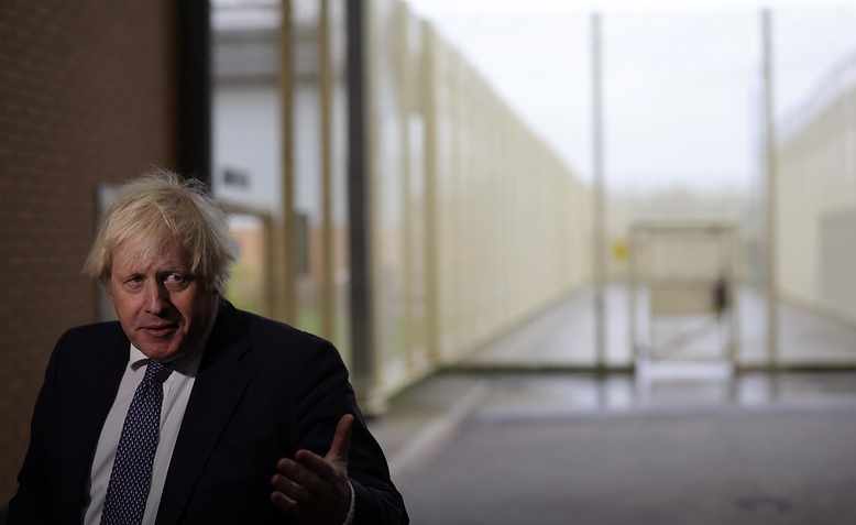 Boris Johnson at a prison, December 2021. Photo: Flickr/Andrew Parsons 