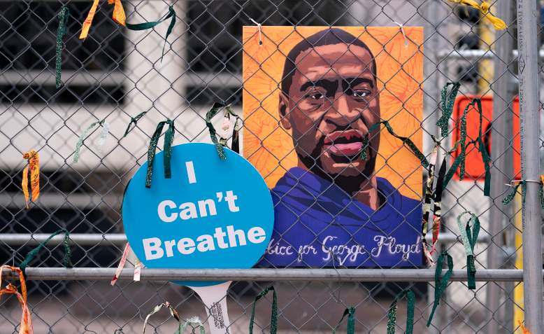 Signs that read 'I Can't Breathe' and 'Justice For George Floyd' attached to the security fencing surrounding the Hennepin County Government Center in Minneapolis, Minnesota