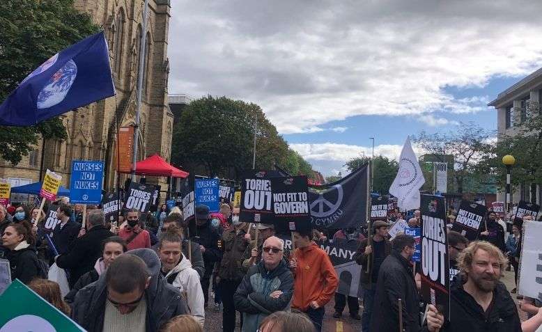 Thousands gather to protest Tory conference in Manchester.