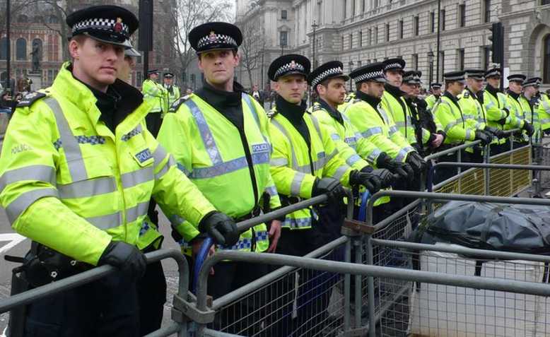 Police barricade, Parliament Square. Photo: Nigel Mykura/cropped from original/licensed under CC 2.0, linked at bottom of article