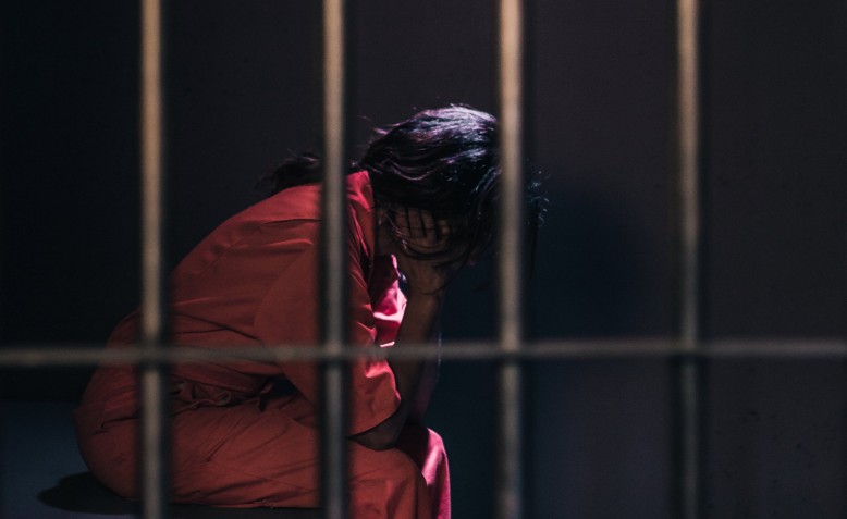 Woman Prison Photo| Photo: Matthew Henry | cropped from original | Public Domain