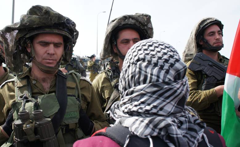 Israeli soldiers confront Palestinians protesting land confiscations, 2012