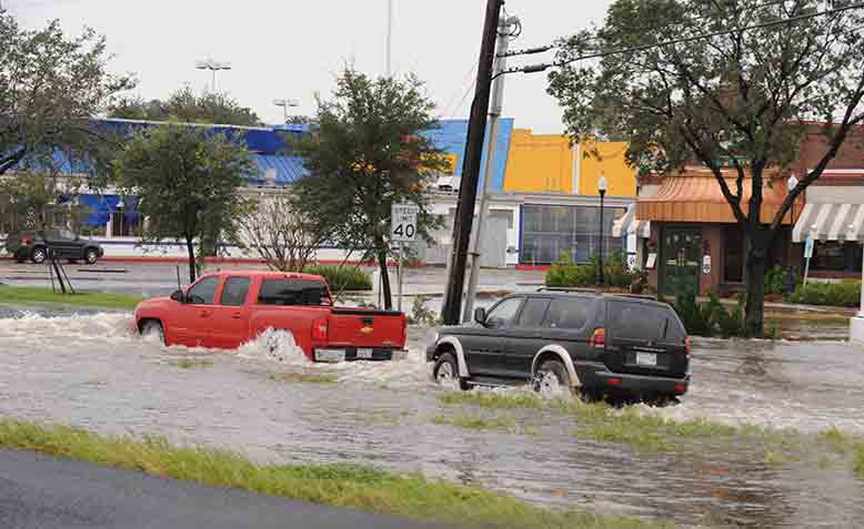 Cars going through flood water in Texas. Photo: Wikipedia