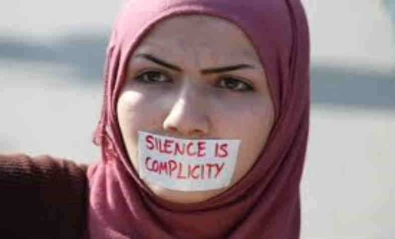 Silence is complicity protestor.  Photo: Islam Awareness Blog