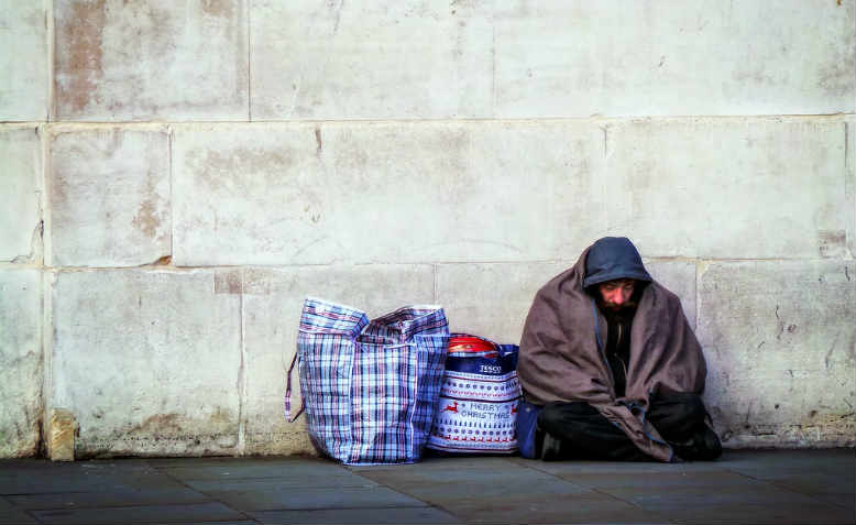 Homeless by a wall. Photo: Flickr/Garry Knight