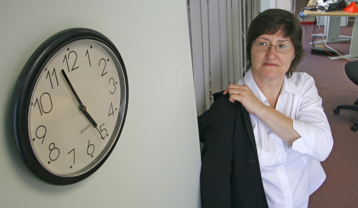 Woman preparing to leave work