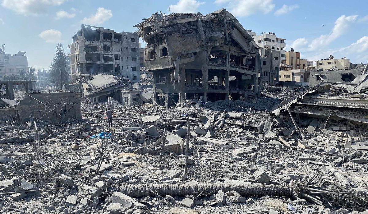 Palestinians inspect the damage in El-Remal area in Gaza City on Oct 9, 2023