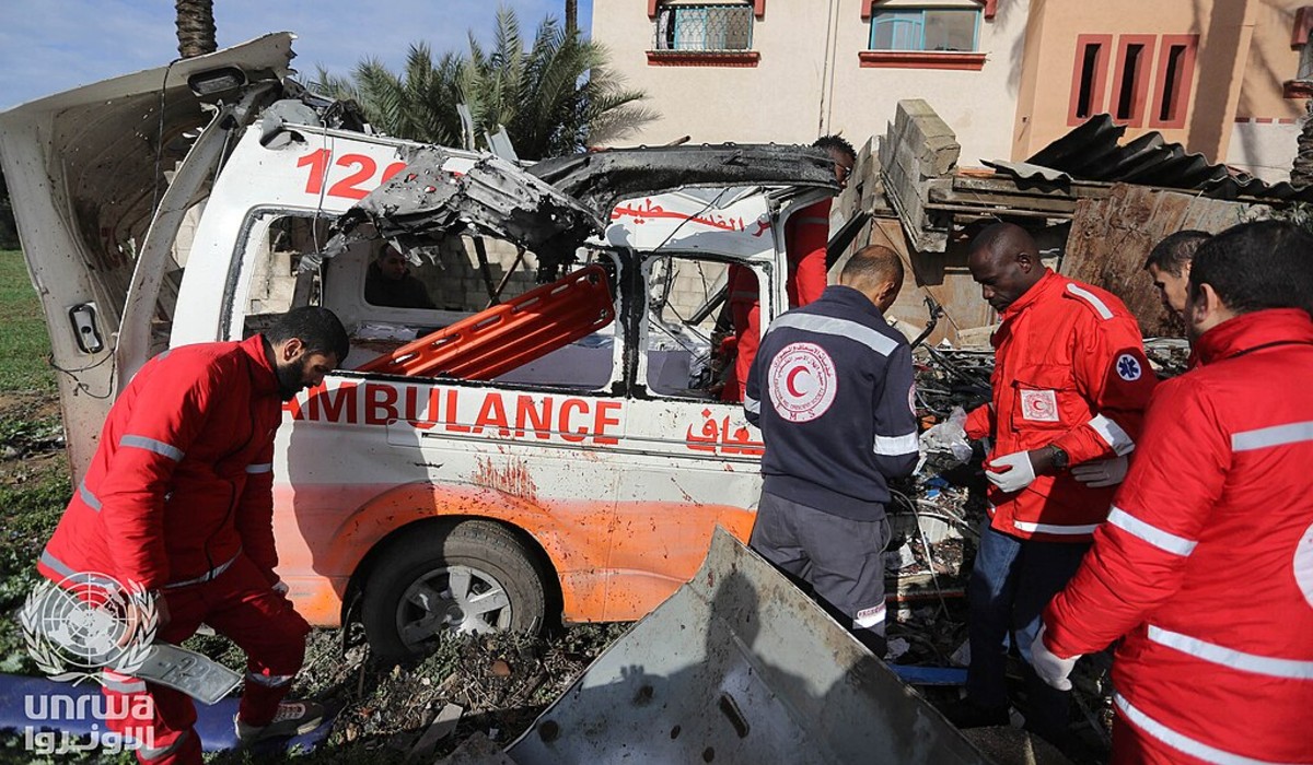 Red Crescent workers inspect bombed ambulance, January 2024. Photo: UNRWA / CC BY-SA 3.0