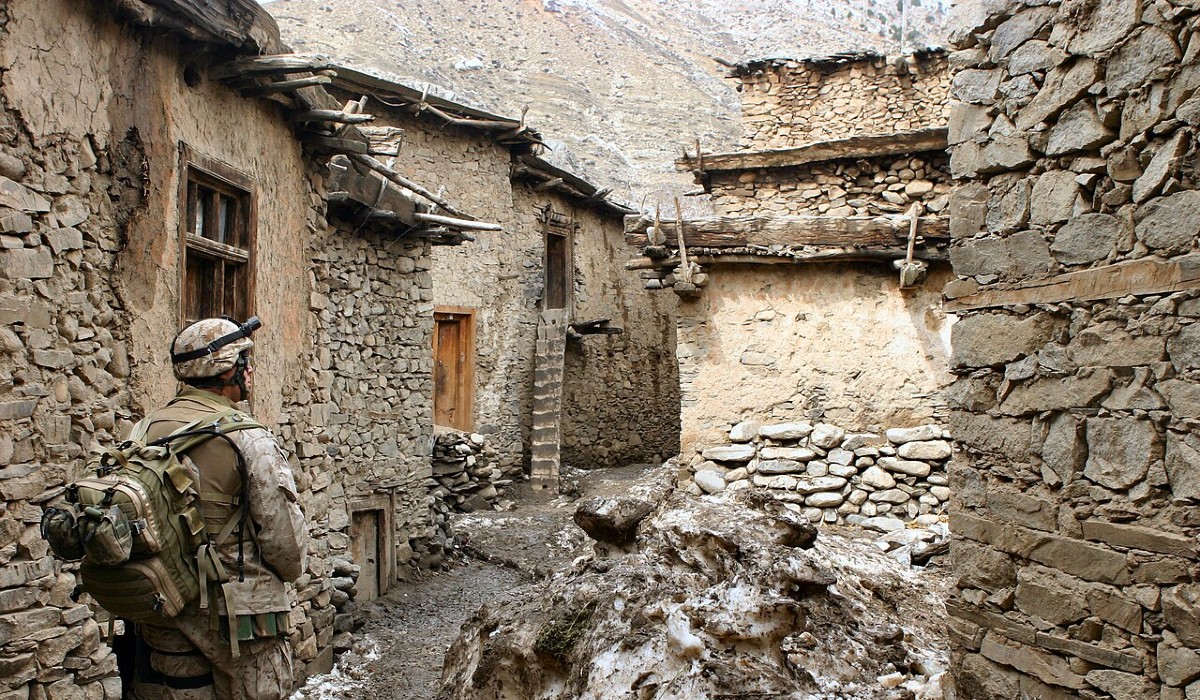 US Navy Corpsman searches for Taliban fighters in Mihtarlam, Afghanistan, 2005
