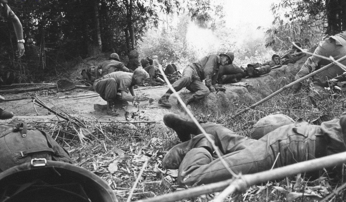 Soldiers of the 28th Infantry's 1st Battalion scramble for cover as Vietnamese fighters open fire from concealed tunnels