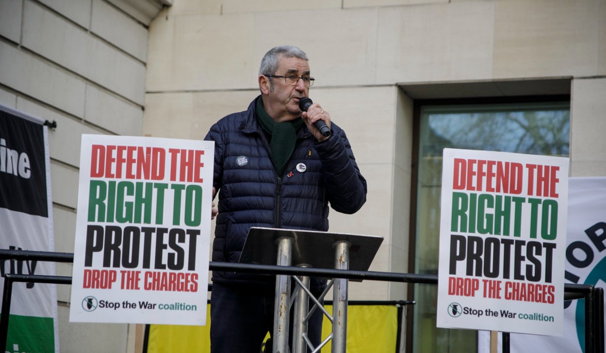 Alex Kenny speaking at a demo outside Westminster Magistrates Court.