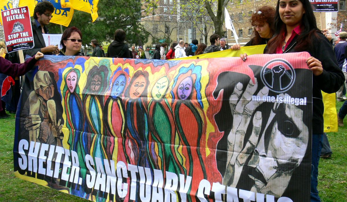 Shelter, santuary, status. poster at the May Day rally 2009 in Toronto.