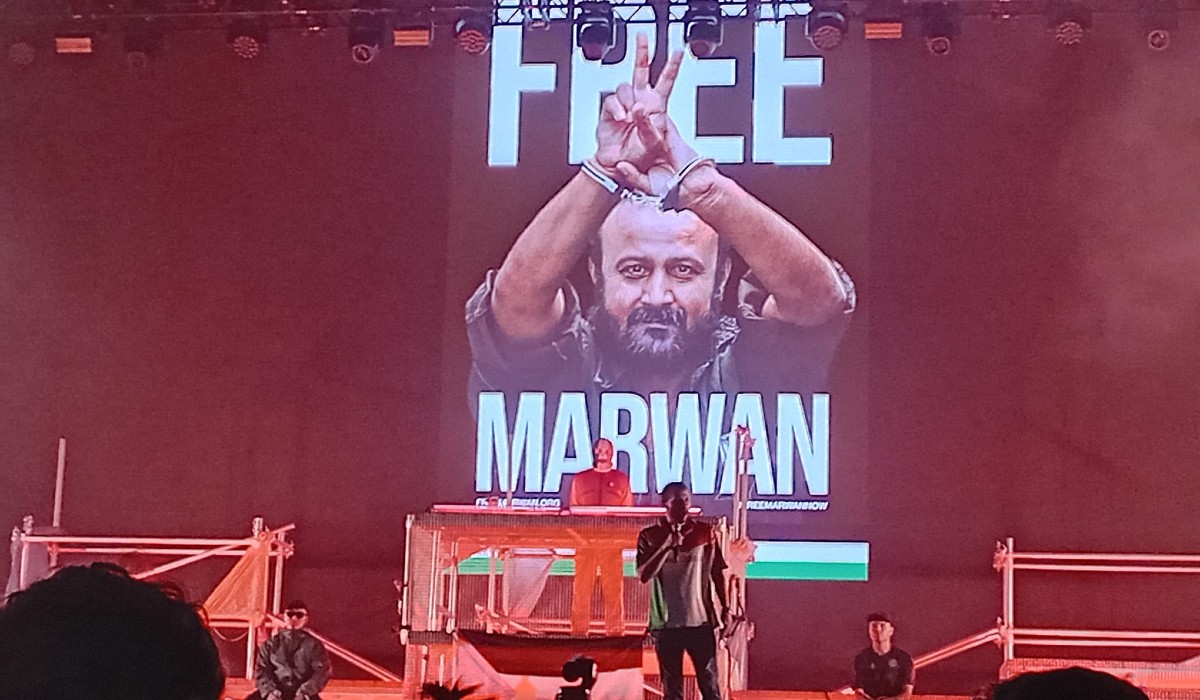 Kneecap's free Marwan stage set with speaker Arab Barghouti, son of Marwan Barghouti