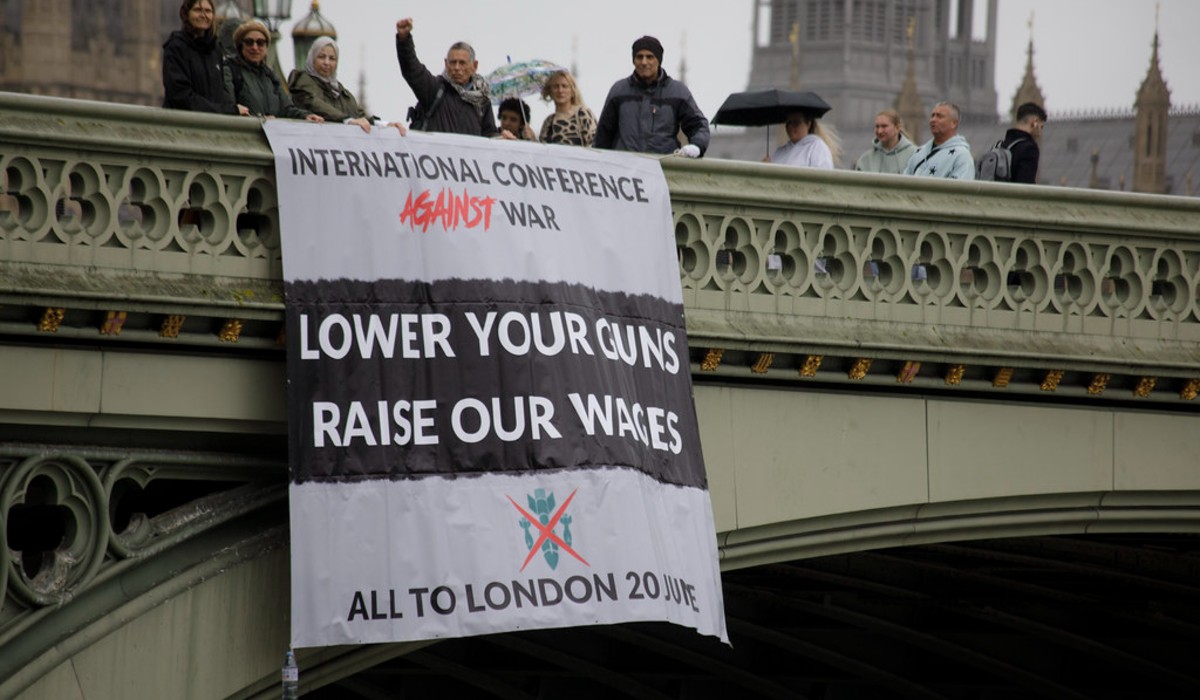 Banner drop for the International Conferece Against War.